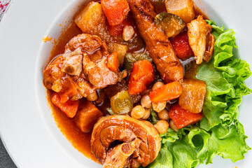 Ragout meat, sausages, vegetables stew dish fresh tasty food delicious gourmet food background on the table rustic food top view copy space