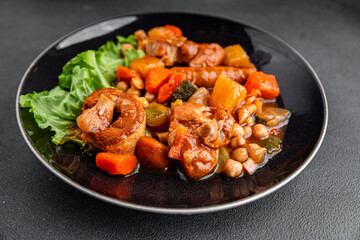 Ragout meat, sausages, vegetables stew dish fresh tasty food delicious gourmet food background on the table rustic food top view copy space