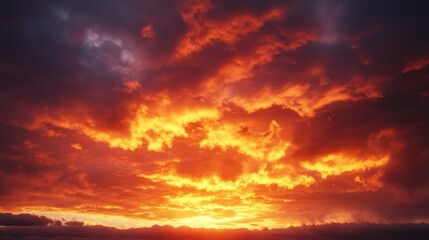 Obraz premium Burning orange clouds dominating the sunset sky creating a dramatic display