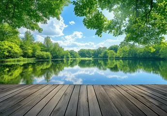 Fototapete Rund Wooden floor, green trees, and blue sky in the background, reflecting the natural landscape. A spring park with a lake and forest, in a wide format photograph © Muhammad