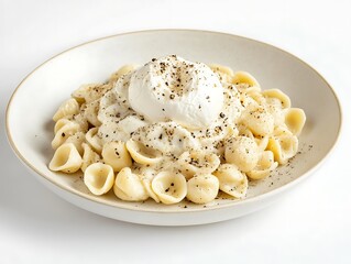 A plate of orecchiette pasta in a creamy truffle alfredo sauce, garnished with a whole burrata and freshly cracked black pepper, placed on a white background.