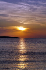 Dreamy summer sunset in Croatian seacoast in purplish and light orange color tones