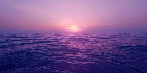 Fototapeta premium An endless expanse of purple, a beautiful sunrise in the distance, a calm and vast ocean surface
