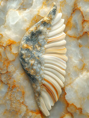 Carved Wing on Marble Surface