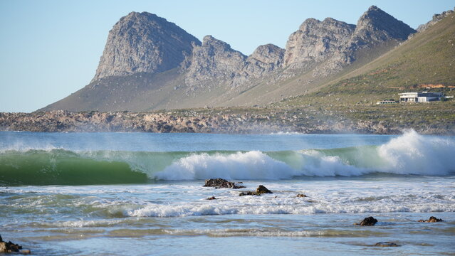Ocean waves rolling through False Bay in the village of Pringle Bay, creating a stunning coastal scene with rugged beauty and dynamic water movement