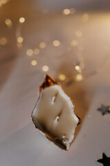 candle in an oyster shell. Massage candle. Massage candle with a cotton wick and decorated pearl in...