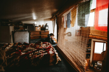 Boy Laying in Loft
