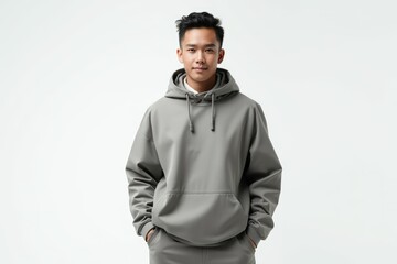 Obraz premium Half-Length (Waist-Up) portrait of young stylish smiling Bruneian male model in futuristic wear isolated on pure white background looking at camera