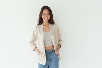 Half-Length (Waist-Up) portrait of young stylish smiling Bruneian female model in casual wear isolated on pure white background looking at camera