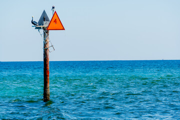 channel marker in ocean