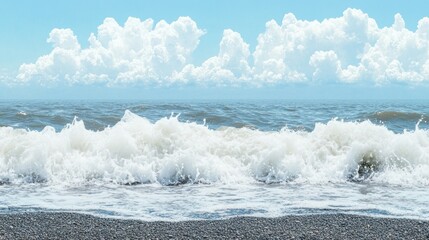 Fototapeta premium Ocean waves crashing on pebble beach, sunny sky