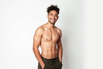 Fototapeta premium Half-Length (Waist-Up) portrait of young stylish smiling Colombian male model in hippie wear isolated on pure white background looking at camera