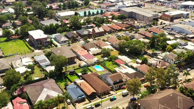 Residential streets and houses in suburbs of Parramatta city with modern high-rise towers.
