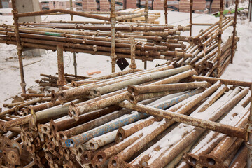 Rusty metal blocks piled together create an appealing industrial aesthetic that captures attention