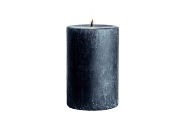 Black candle with flame in soft light setting, cut out