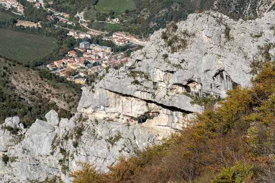 Panoramic view of rocky slope of Mount Nerone with natural arch Balza Forata, in the Apennines range in province of Pesaro-Urbino - Powered by Adobe