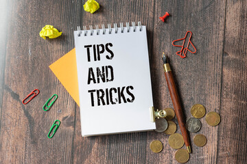 Wooden blocks with the words Tips and Tricks. Tips and tricks icon.