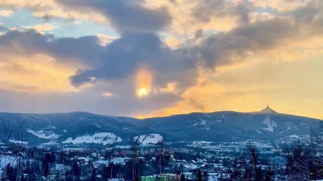 Beautiful sunset over snow-capped mountains and city Liberec. High quality 4k footage