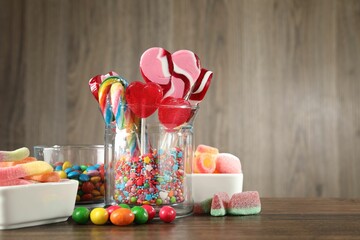 Candy bar. Many different tasty sweets on wooden table