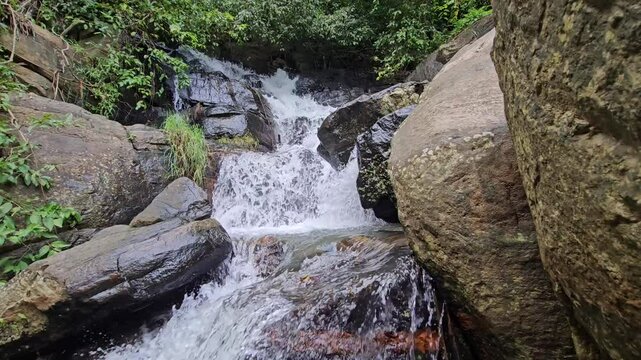 Small Waterfall Cascading in Lush Forest, Ella, Sri Lanka