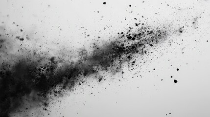 A dramatic black and white dust explosion swirls with chaotic energy; fine, irregular particles burst across a stark background, evoking intensity and movement