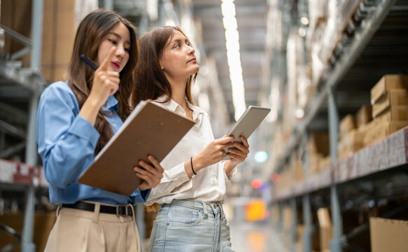 Female engineers team discussing inventory in warehouse logistics and supply chain planning, operation management, data analysis, warehouse shipping, inventory tracking, optimization and technology