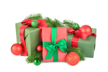 Gift boxes with Christmas tree branches and balls on white background