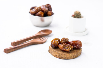 Delicious dried dates, popular fruit dates during the month of Ramadan in a silver bowl
