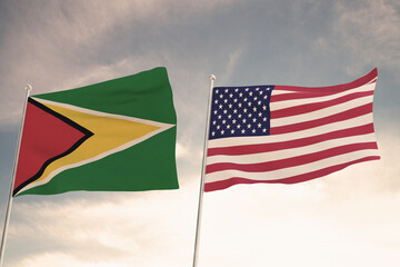 Relations between Guyana and United States of America USA US symbolized by two flags waving against a cloudy sky. 3D render.