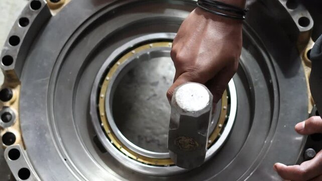 Close-Up Installing bearing use hammer. Automatic Transmission Rebuild in Garage services, assembly automatic transmission at garage or repair factory station