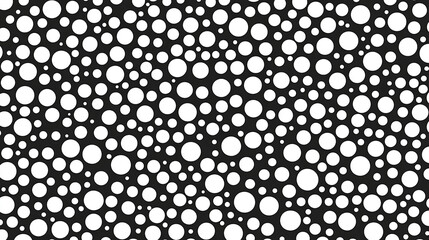 Abstract pattern of varying sizes of white circles on a black background, suitable for design use