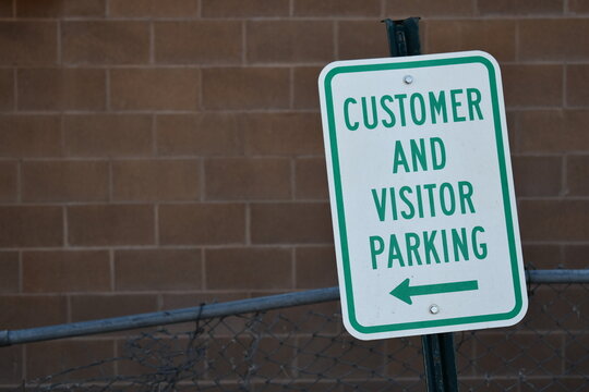 Customer and visitor parking sign.