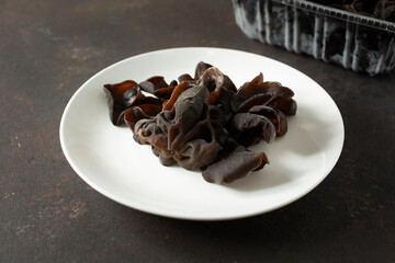 A view of a wood ear mushroom on a plate.
