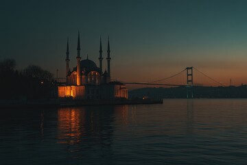 Fototapeta premium Illuminated mosque at sunset, bridge and water reflection.