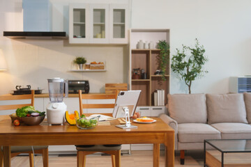 Fresh vegetables and fruits with a blender placed on the kitchen table, representing good health care, nutrition, and a healthy lifestyle through natural ingredients for balanced well-being wellness