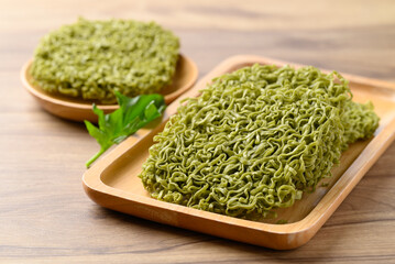 Instant green noodles on wooden plate, Asian food