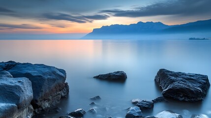 Obraz premium Tranquil sunrise over a calm lake, evoking peace and serenity. 