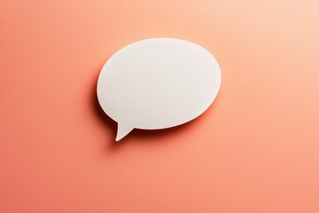 A white speech bubble resting on a coral colored background