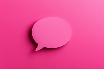 A pink colored speech bubble on a vibrant solid background