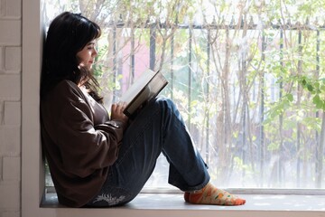student girl reads a book