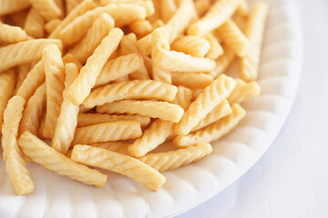 Crispy prawn cracker sticks, Shrimp crisp rice snack. Concept, traditional crunchy food snack appetizer. Junk food. Selective focus                  