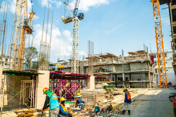 Construction site condominium building with man