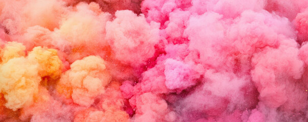 Fototapeta premium A vibrant cloud of pink, orange, and pastel hues, creating a dreamy and ethereal atmosphere, reminiscent of smoke or powder.