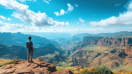 Obraz premium Man contemplates vast Ethiopian mountain landscape