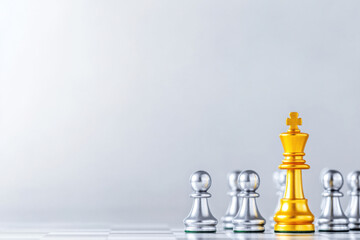 golden chess piece stands out among silver pawns, symbolizing strategy and competition in game of chess. contrast highlights importance of each piece on board