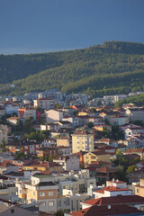 Cityscape view of residential buildings against mountains