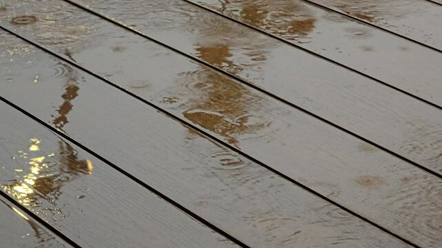 rainwater falls on the surface of the wooden floor