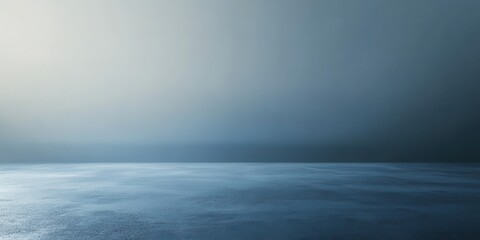 Fototapeta premium A gradient blue backdrop showcases a textured concrete floor