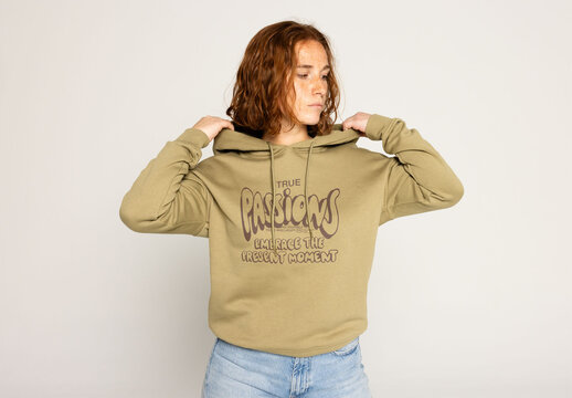 Redhead Woman in Hooded Sweater Showcasing Logo Mockup. Note: jumper&acute;s color cannot be changed.