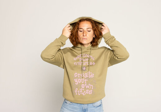 Redhead Woman in Hooded Sweater Ready for Your Logo Design. Note: jumper&acute;s color cannot be changed.